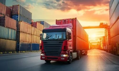 Midjourney_ Sunset scene of semi-truck transporting cargo containers at a port_